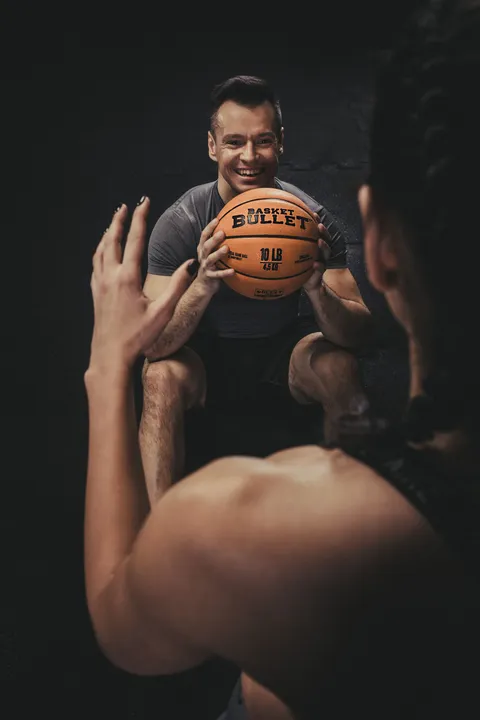 Paired training with a Basket Bullet medicine ball