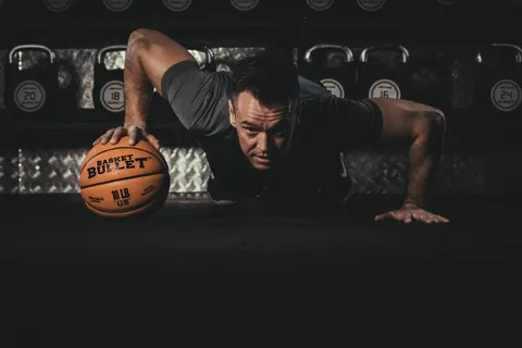 Single-arm press with a Basket Bullet medicine ball