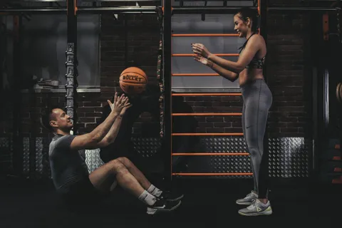 Paired training with a Basket Bullet medicine ball